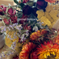 Close-up of Eternal Embrace Dried Flower Bouquet Showing Orange and Red Roses, Lavender, Bunny Tails Grass, and Pampas Grass Stems