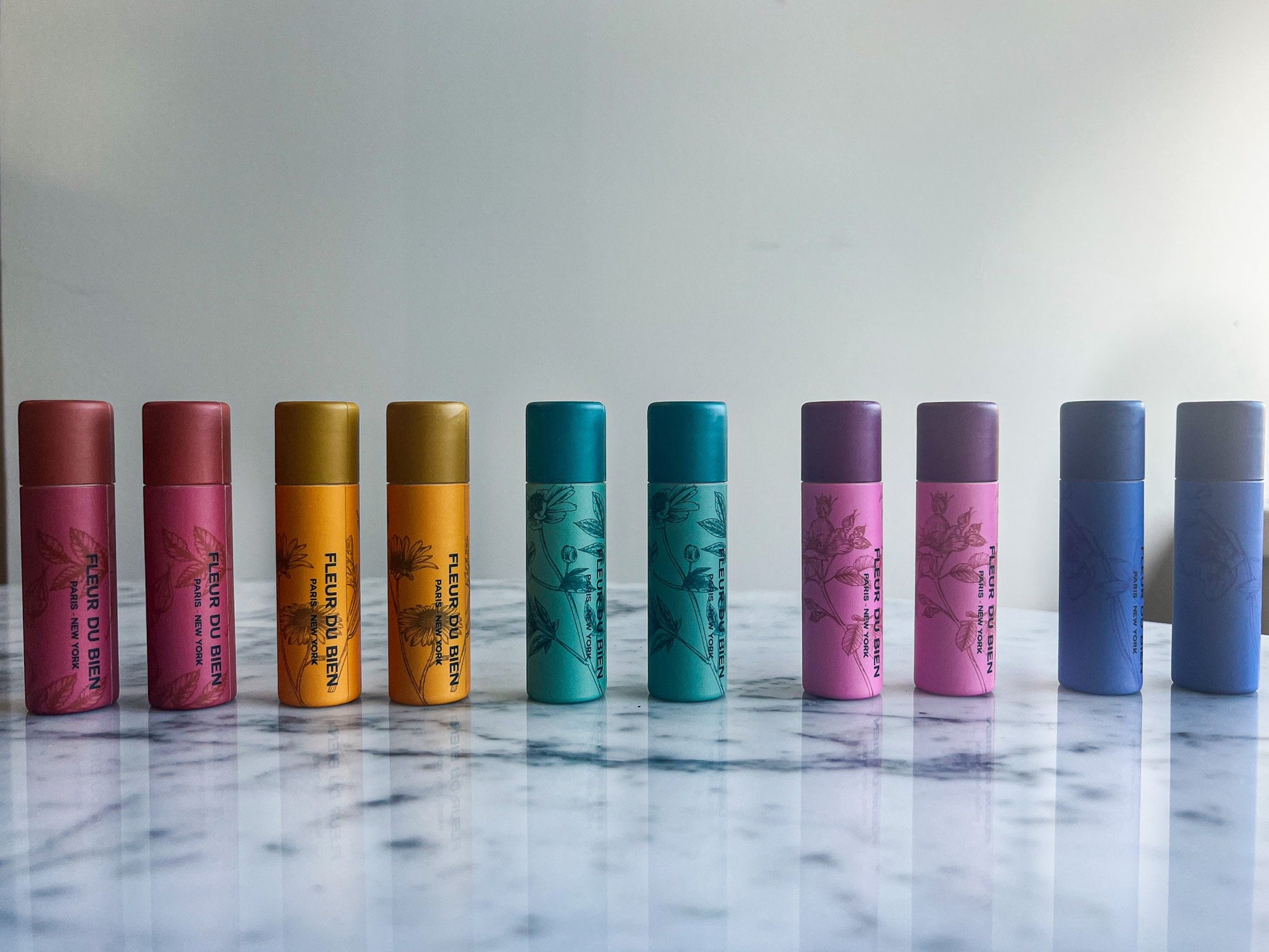 Fleur Du Bien DIY Lip Balm & Lip Gloss finished tubes, organic and natural ingredients, handmade design with colorful floral accents, eco-friendly and perfect as a gift
