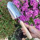 Fleur Du Bien Garden Tools Close-Up – hand trowel, transplanter, hand cultivator, 5-tine rake, root weeder, and bypass pruner with ergonomic wooden handles, rust and corrosion-resistant