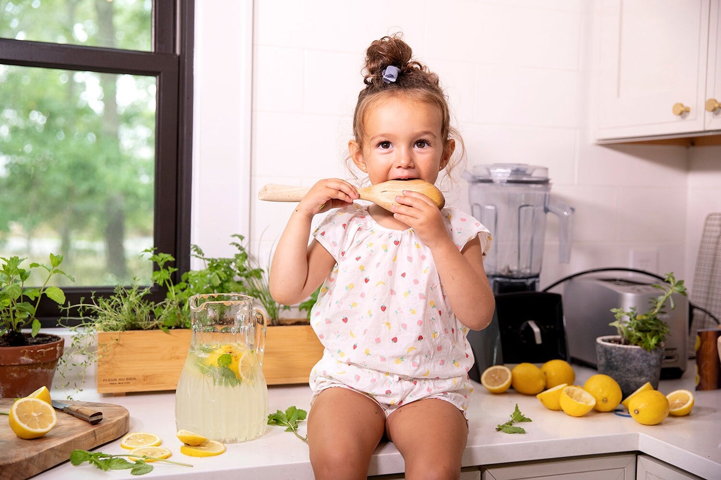 Kids cooking with fresh herbs from Fleur Du Bien Indoor Herb Garden Kit – making healthy lemonade with mint, grown at home, knowing exactly what you use